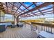Spacious backyard deck with pergola, seating area, and mountain views at 7587 Wright Ct, Arvada, CO 80005