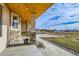 Inviting front porch with stone accents and a potted plant at 7587 Wright Ct, Arvada, CO 80005