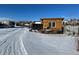 Wooden structure and goat enclosure in snowy yard at 7587 Wright Ct, Arvada, CO 80005
