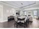 Elegant dining room with open access to the Gathering room and fireplace at 7587 Wright Ct, Arvada, CO 80005