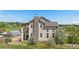 The rear exterior features a stone chimney, and a deck with outdoor space for relaxation at 7587 Wright Ct, Arvada, CO 80005
