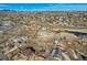 Wide aerial view of house and surrounding neighborhood with mountain views at 7587 Wright Ct, Arvada, CO 80005