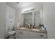 Bright bathroom features double sinks and granite counters at 865 S Quebec St # 302A, Denver, CO 80247