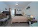 Bright bedroom featuring a comfortable bed and television at 865 S Quebec St # 302A, Denver, CO 80247