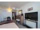 Bedroom featuring a closet and decorative mirror at 865 S Quebec St # 302A, Denver, CO 80247