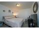 Cozy bedroom featuring a soft bed and a simple decor at 865 S Quebec St # 302A, Denver, CO 80247