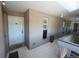 Exterior entrance featuring neutral stucco, a storm door and a welcome mat at 865 S Quebec St # 302A, Denver, CO 80247
