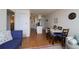 Inviting living space showcasing hardwood floors connecting the living room and kitchen at 865 S Quebec St # 302A, Denver, CO 80247