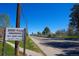 Community sign reads 'Quebec Plaza Condominiums, 865 S. Quebec Street' at 865 S Quebec St # 302A, Denver, CO 80247