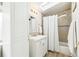 Bright bathroom featuring a shower/tub combination, skylight, and a modern vanity with storage at 1970 Willow St, Denver, CO 80220