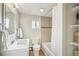 Clean and bright bathroom with tiled shower and modern fixtures at 1970 Willow St, Denver, CO 80220