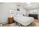 Inviting bedroom with a sloped ceiling, modern decor, and plenty of natural light at 1970 Willow St, Denver, CO 80220
