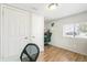 A small bedroom with light walls, a window, and a desk at 1970 Willow St, Denver, CO 80220