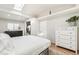 Bedroom with white walls, hardwood floors, and lots of natural light and a closet at 1970 Willow St, Denver, CO 80220