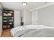 Neutral toned bedroom, featuring hardwood floors, built-in storage, and modern decor at 1970 Willow St, Denver, CO 80220