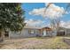 Charming single-story home with covered porch and tidy front yard at 1970 Willow St, Denver, CO 80220