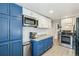 Renovated kitchen with sleek appliances, ample cabinet storage, and stylish countertops at 1970 Willow St, Denver, CO 80220