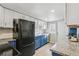 Modern kitchen featuring stainless steel appliances and two-tone cabinets with great countertop space at 1970 Willow St, Denver, CO 80220