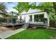 Landscaped backyard with a spacious deck and outdoor entertainment area at 635 Fillmore St, Denver, CO 80206