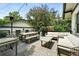 Large backyard deck featuring outdoor seating, a dining table, and a heater at 635 Fillmore St, Denver, CO 80206