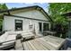 Backyard with dining and seating area on the raised deck, perfect for outdoor gatherings at 635 Fillmore St, Denver, CO 80206