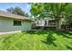 Lush backyard featuring a detached garage and deck perfect for outdoor entertainment at 635 Fillmore St, Denver, CO 80206