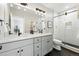 Modern bathroom with double vanity, sleek fixtures, and glass-enclosed shower at 635 Fillmore St, Denver, CO 80206