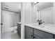 Bright bathroom with white subway tile, updated vanity, and black hardware at 635 Fillmore St, Denver, CO 80206