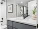 Updated bathroom with white subway tile, modern vanity, and matte black finishes at 635 Fillmore St, Denver, CO 80206