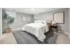 Cozy bedroom featuring a plush bed, bedside lamps, and a stylish rug creating a welcoming atmosphere at 635 Fillmore St, Denver, CO 80206