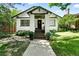 Charming, Craftsman style home with a manicured front yard and inviting entryway at 635 Fillmore St, Denver, CO 80206