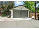 Detached two car garage with neutral color scheme and updated doors at 635 Fillmore St, Denver, CO 80206
