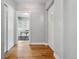 A clean hallway with hardwood floors featuring a door with diamond window at 635 Fillmore St, Denver, CO 80206