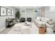 Cozy living room featuring neutral decor, comfortable seating, and ample natural light from the windows at 635 Fillmore St, Denver, CO 80206
