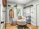 Stylish walk-in closet with clothing racks and natural light at 635 Fillmore St, Denver, CO 80206