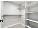White walk-in closet with installed shelving and hanging racks at 635 Fillmore St, Denver, CO 80206