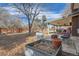 Large backyard with covered patio and fire pit at 7005 S Ash Cir, Centennial, CO 80122