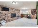 Finished basement features a brick fireplace and plenty of space for recreation at 7005 S Ash Cir, Centennial, CO 80122