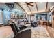 Spacious basement featuring a full bar, seating area, and unique architectural details at 7005 S Ash Cir, Centennial, CO 80122