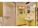 Bathroom featuring a standing shower, pedestal sink, mirror and towel rack at 7005 S Ash Cir, Centennial, CO 80122