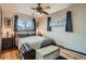 Bedroom with queen bed, hardwood floor, and window at 7005 S Ash Cir, Centennial, CO 80122