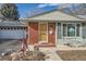 Brick home's front entrance with a small patio at 7005 S Ash Cir, Centennial, CO 80122