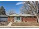 Brick ranch home with attached garage and landscaped yard at 7005 S Ash Cir, Centennial, CO 80122