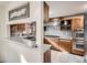 View of the kitchen with wood cabinets, and stainless steel appliances at 7005 S Ash Cir, Centennial, CO 80122