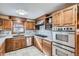 Kitchen with stainless steel appliances and wood cabinets at 7005 S Ash Cir, Centennial, CO 80122