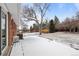 Spacious backyard featuring a patio covered in snow at 31 W Fremont Ave, Littleton, CO 80120