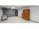 Spacious basement featuring neutral carpet and grey accent wall at 31 W Fremont Ave, Littleton, CO 80120