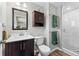 Bathroom boasts modern fixtures, a vanity, and a stylish glass-enclosed shower at 31 W Fremont Ave, Littleton, CO 80120