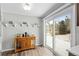 Bright breakfast nook features wood floors, coffee bar and sliding glass doors to the backyard at 31 W Fremont Ave, Littleton, CO 80120