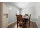 Traditional dining room features wood floors, gray walls, and a dining table with seating for four at 31 W Fremont Ave, Littleton, CO 80120